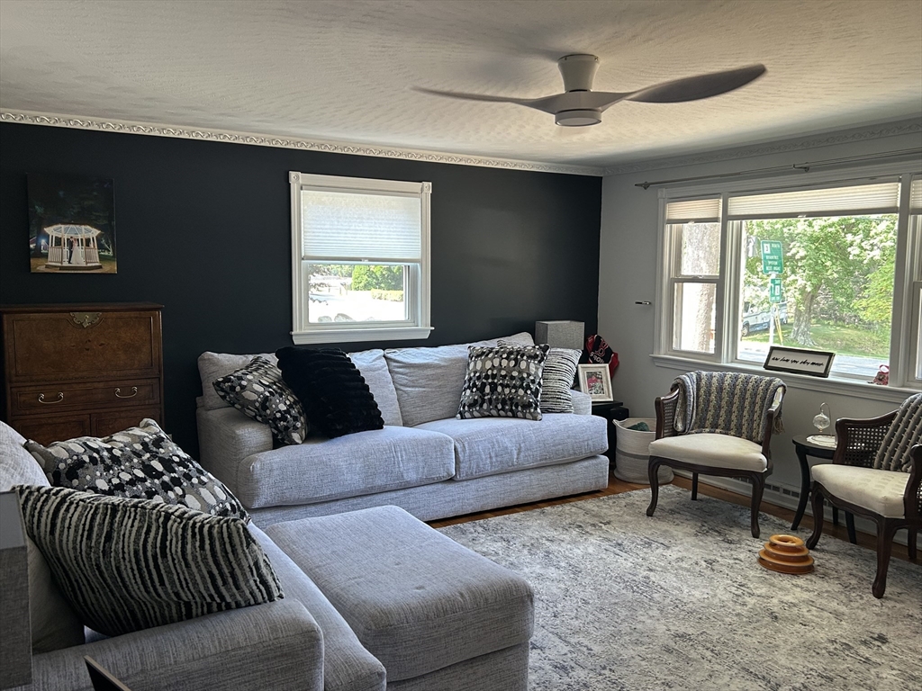 48 Smiths Lane Kingston, MA 02364 - Photo 2 of 22 a living room with furniture ceiling fan and a window