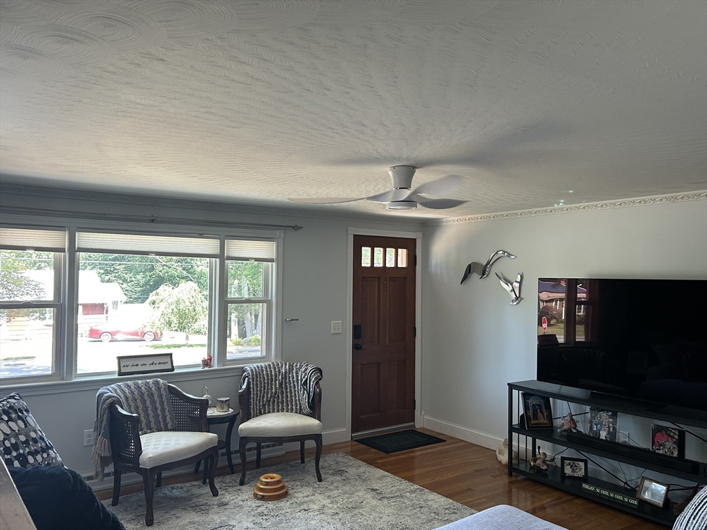 48 Smiths Lane Kingston, MA 02364 - Photo 3 of 22 a living room with furniture and a flat screen tv