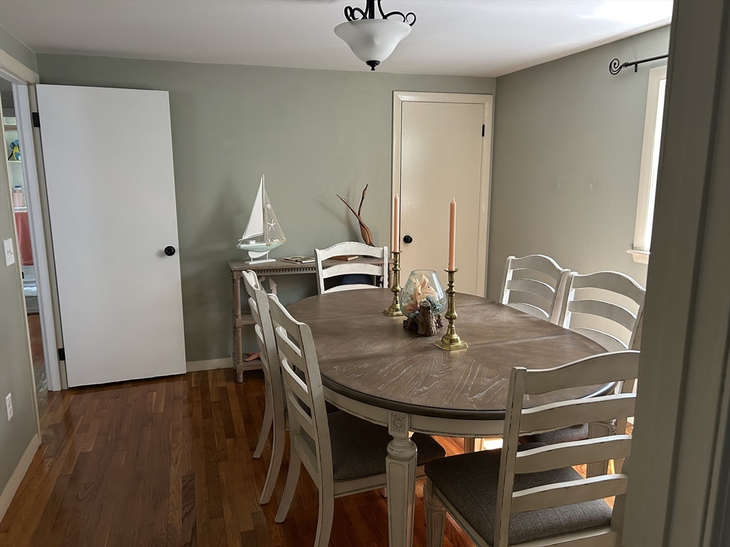 48 Smiths Lane Kingston, MA 02364 - Photo 4 of 22 a dining table with chairs and wooden floor