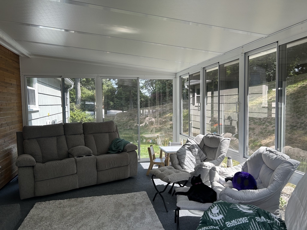 48 Smiths Lane Kingston, MA 02364 - Photo 6 of 22 a living room with furniture and floor to ceiling windows