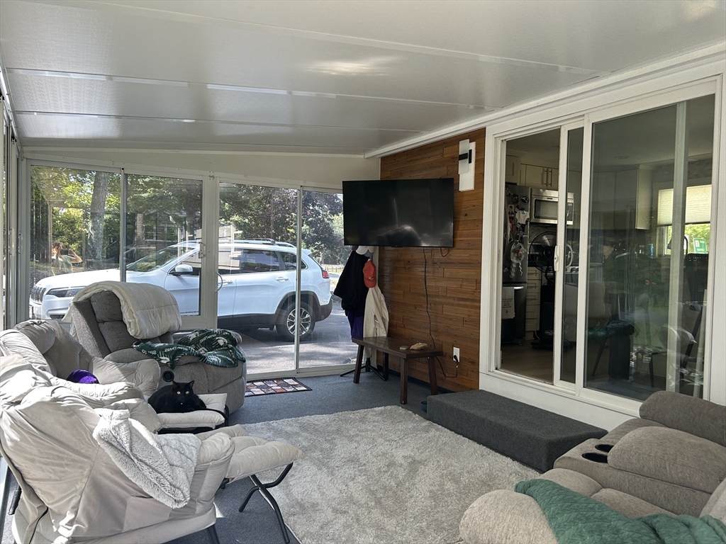 48 Smiths Lane Kingston, MA 02364 - Photo 7 of 22 a living room with furniture tv and a window