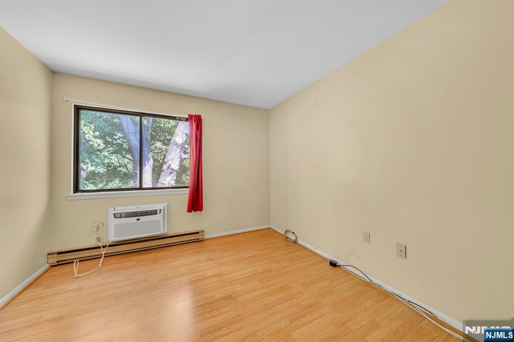 666 Mill Street, Unit C6 Belleville, NJ 07109 - Photo 17 of 25 an empty room with windows and closet