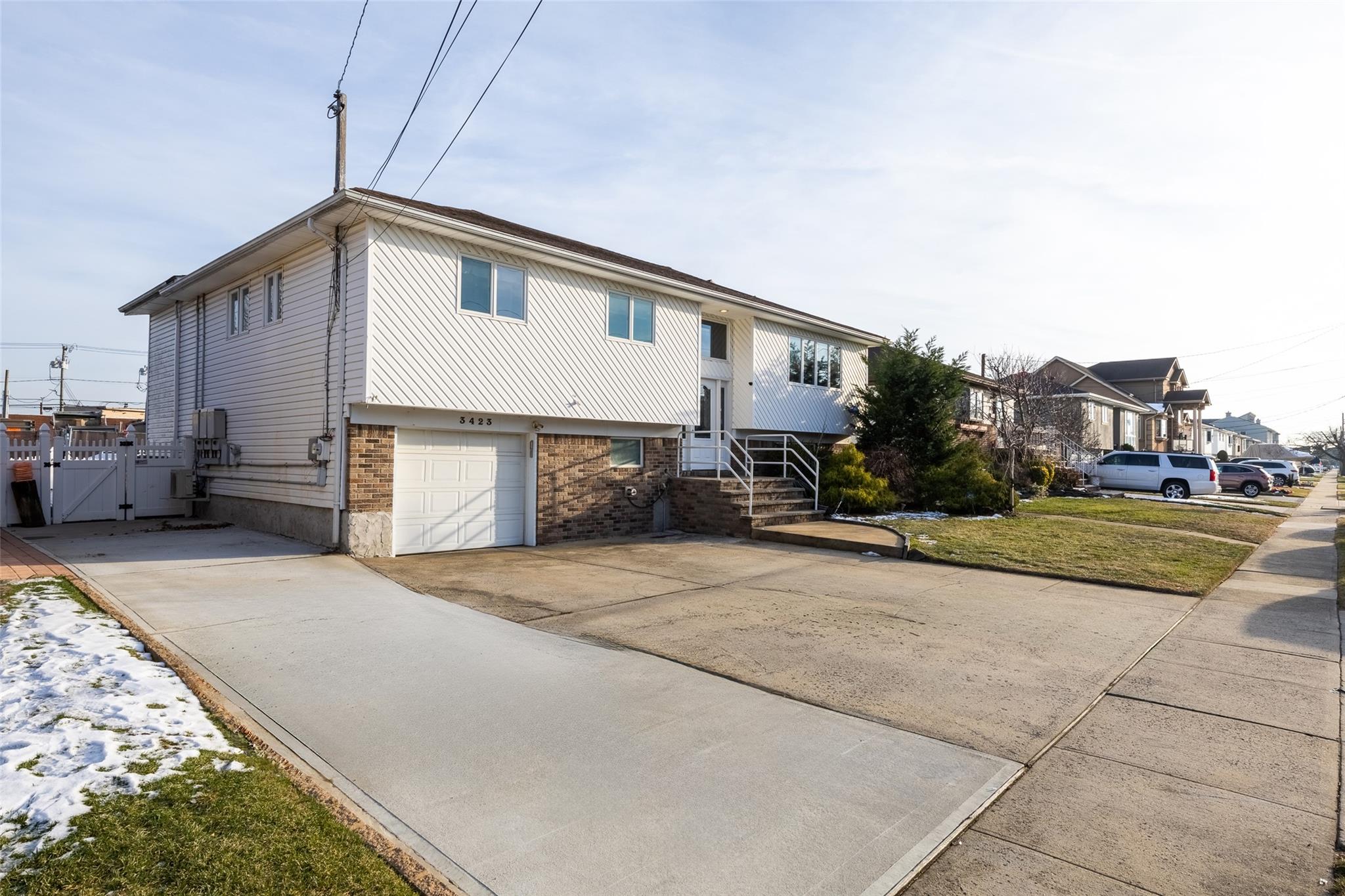 3423 Westminster Road Oceanside, NY 11572 - Photo 1 of 1 a view of street along with house and car parked