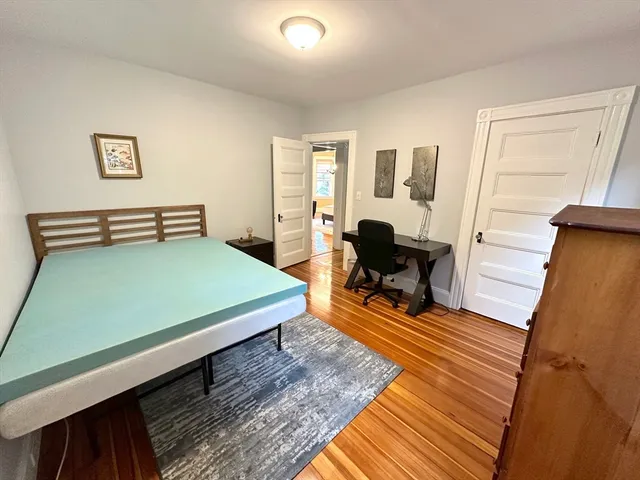 a room with furniture and wooden floor
