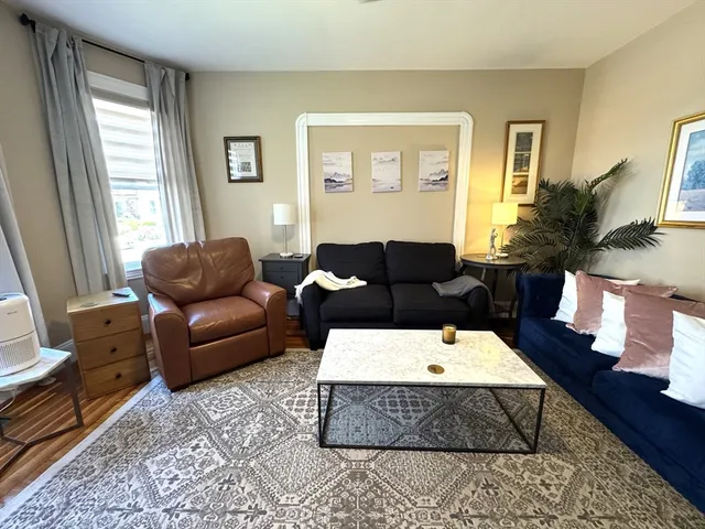 a living room with furniture and a couch