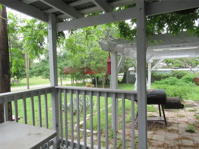 a view of a patio with a large window