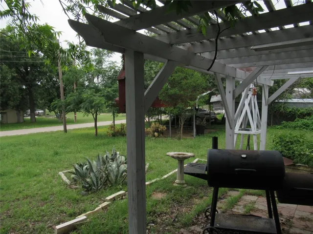 a view of a two chairs in a yard