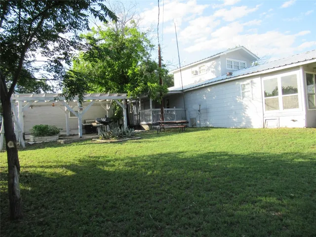 a view of a backyard with a garden and plants