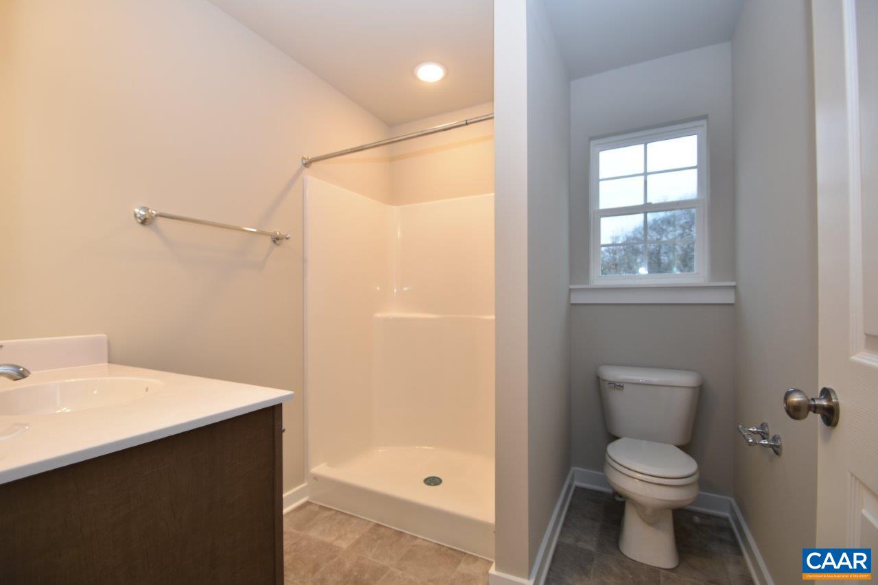 1140 Hanback Road Gordonsville, VA 22942 - Photo 3 of 16 a bathroom with a sink a toilet and shower