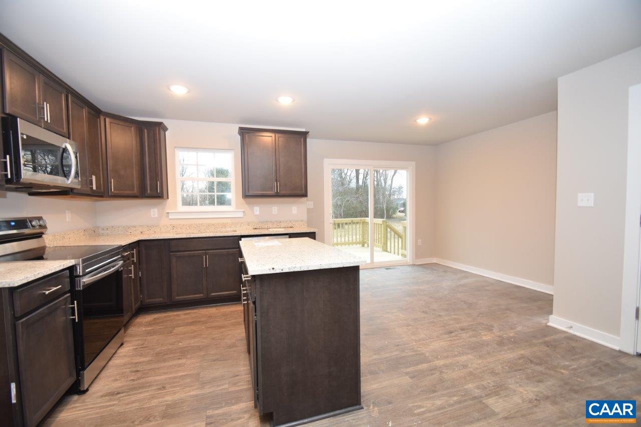 1140 Hanback Road Gordonsville, VA 22942 - Photo 8 of 16 a kitchen with stainless steel appliances granite countertop a stove sink and cabinets