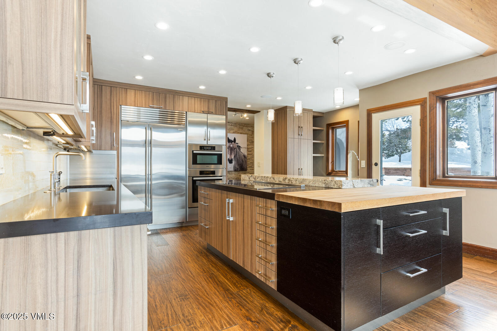141 Corral Road, Unit A Edwards, CO 81632 - Photo 14 of 51 a large kitchen with stainless steel appliances granite countertop a lot of counter space and a sink