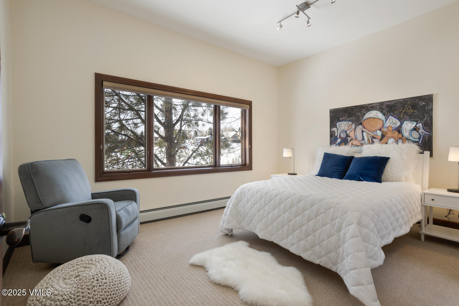 141 Corral Road, Unit A Edwards, CO 81632 - Photo 34 of 51 a bedroom with a bed and chair with the outer view