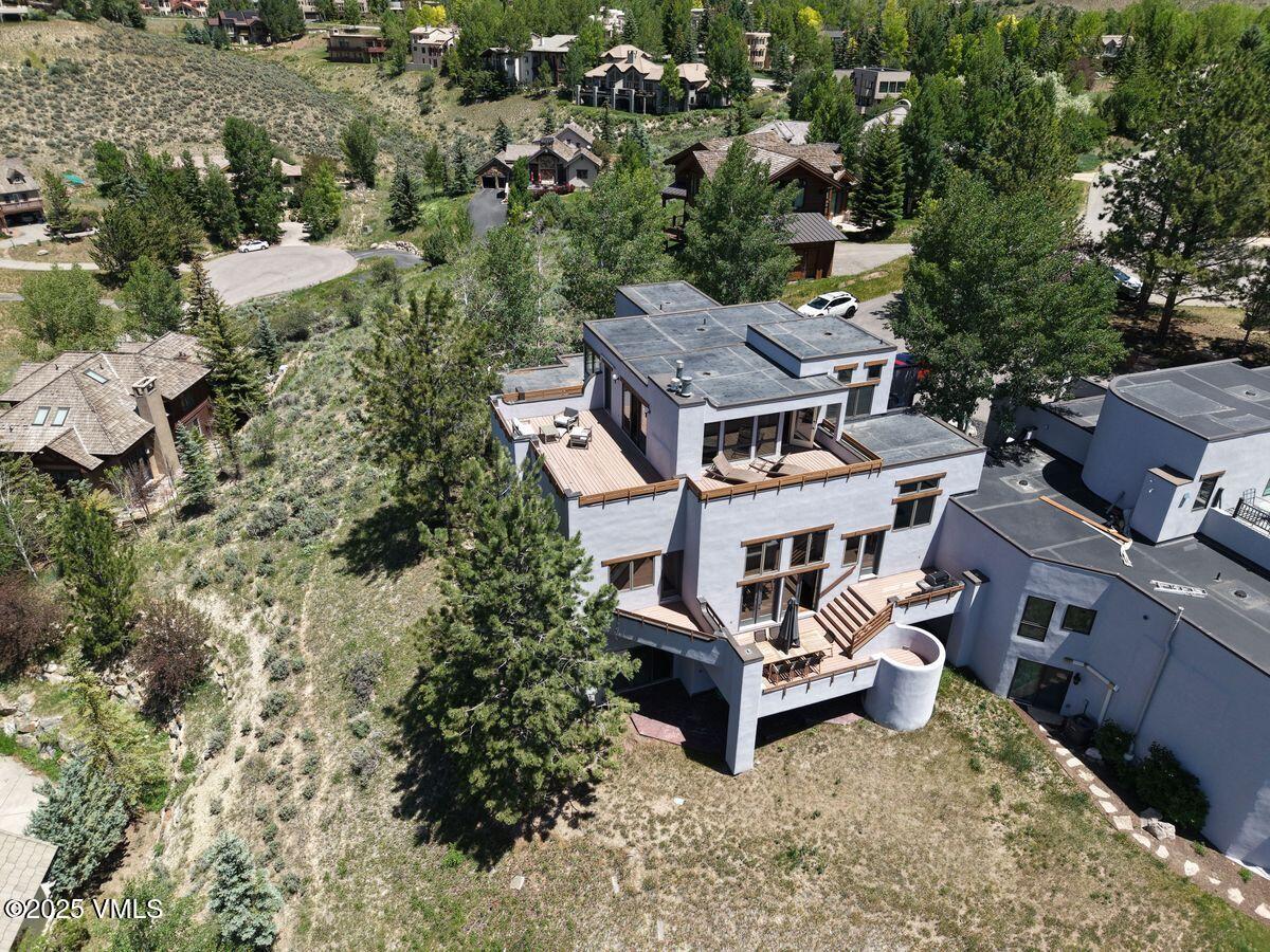 141 Corral Road, Unit A Edwards, CO 81632 - Photo 48 of 51 an aerial view of a house with swimming pool and trees