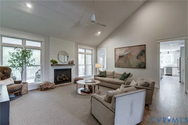 a kitchen with cabinets stainless steel appliances a sink and a window