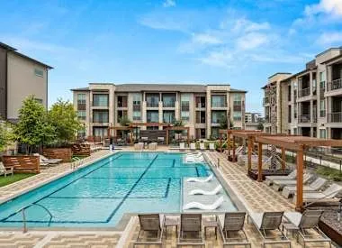 a view of a swimming pool with outdoor seating