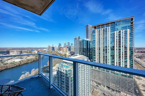 a view of a balcony with city view
