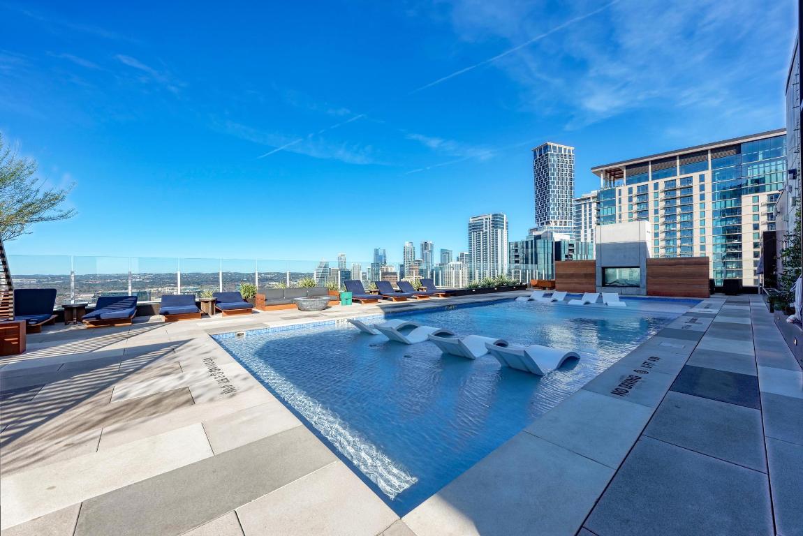 48 East Avenue, Unit 2802 Austin, TX 78701 - Photo 19 of 38 a view of swimming pool with outdoor seating and plants