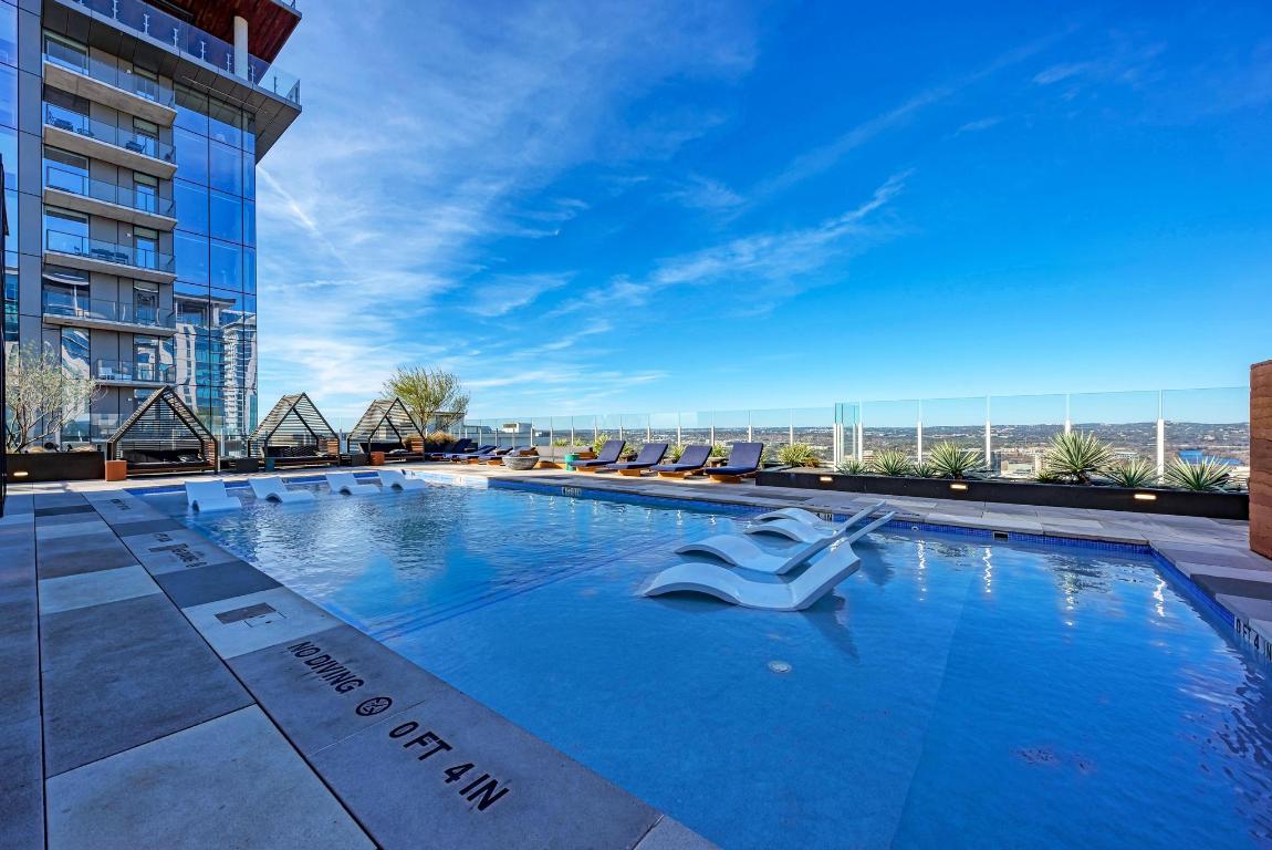 48 East Avenue, Unit 2802 Austin, TX 78701 - Photo 20 of 38 a view of a swimming pool and an ocean