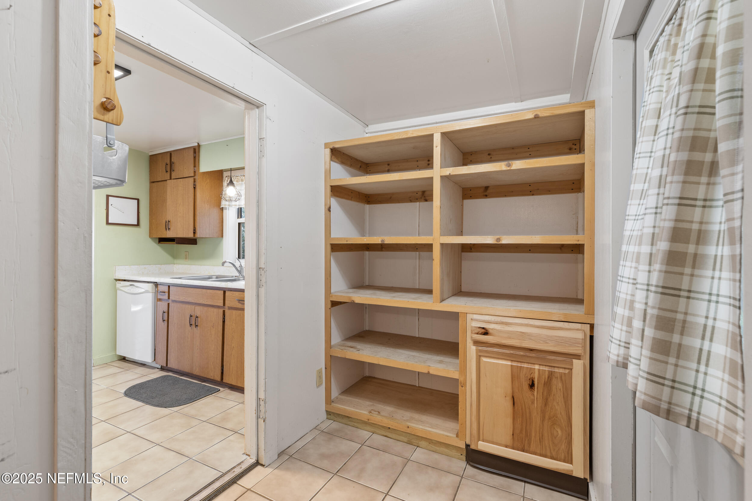 6441 Baker Road Keystone Heights, FL 32656 - Photo 11 of 66 a en suite bathroom with a granite countertop sink and a mirror