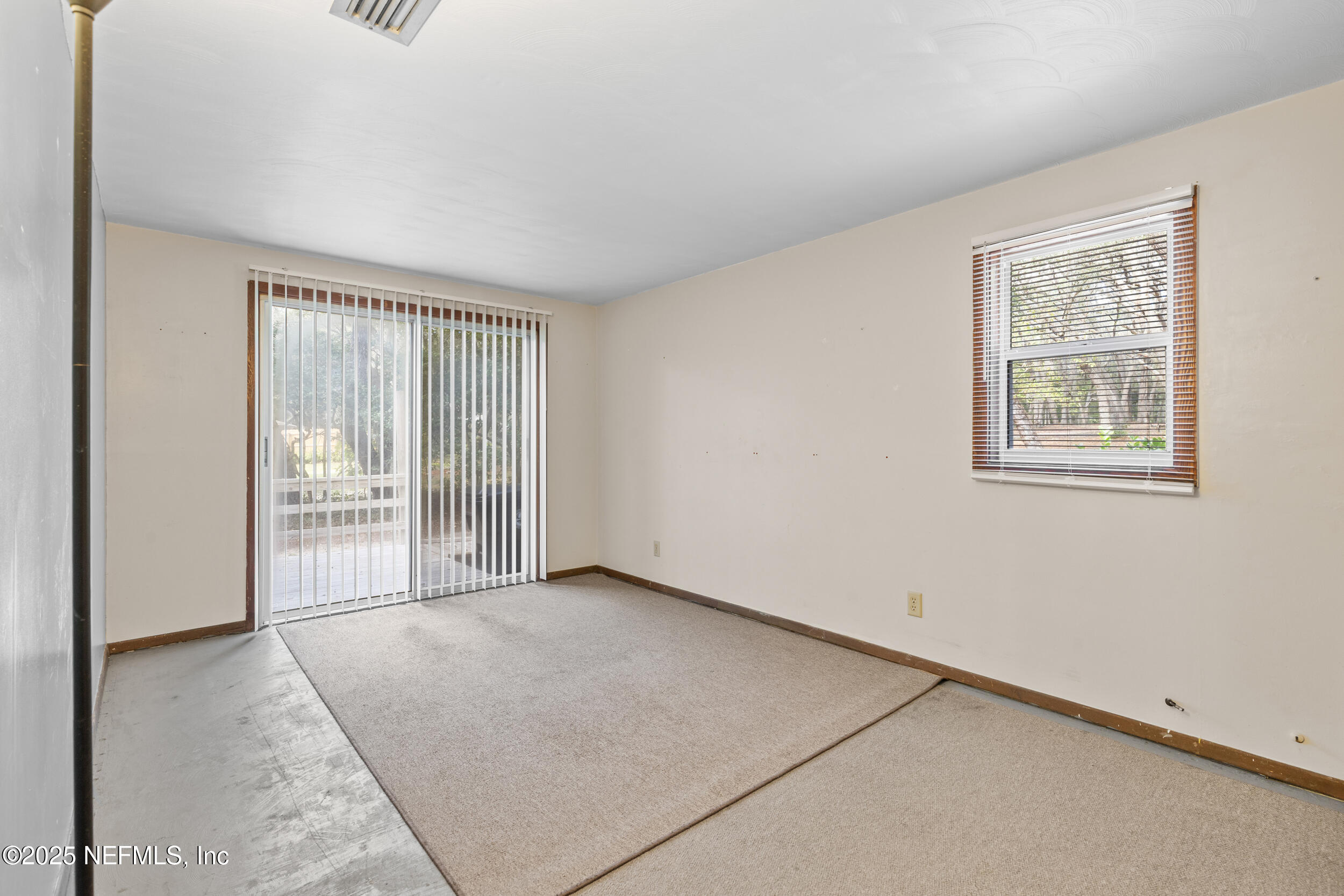 6441 Baker Road Keystone Heights, FL 32656 - Photo 14 of 66 an empty room with windows
