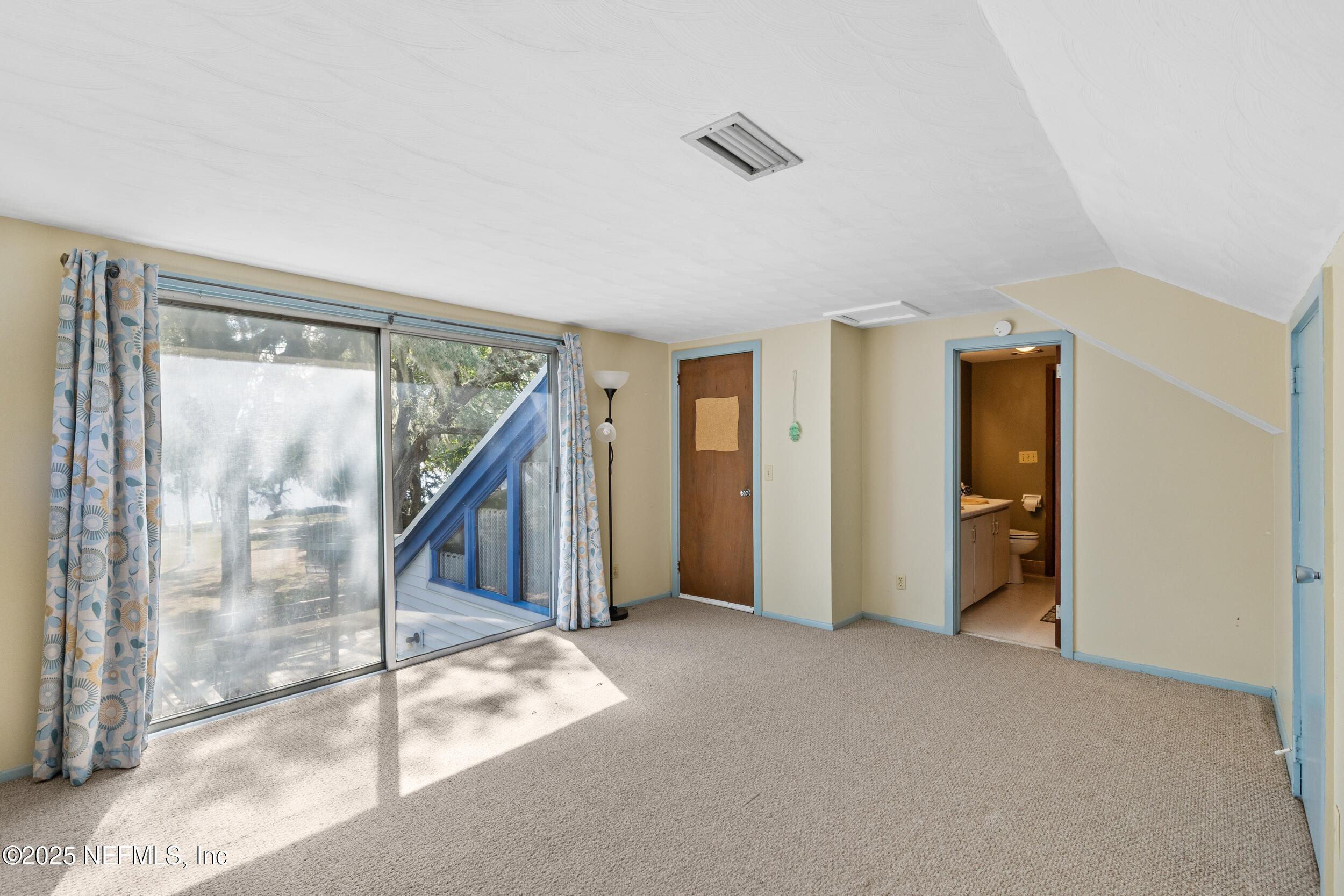 6441 Baker Road Keystone Heights, FL 32656 - Photo 21 of 66 a view of an empty room with a window