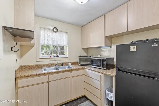 a view of a swimming pool with seating area