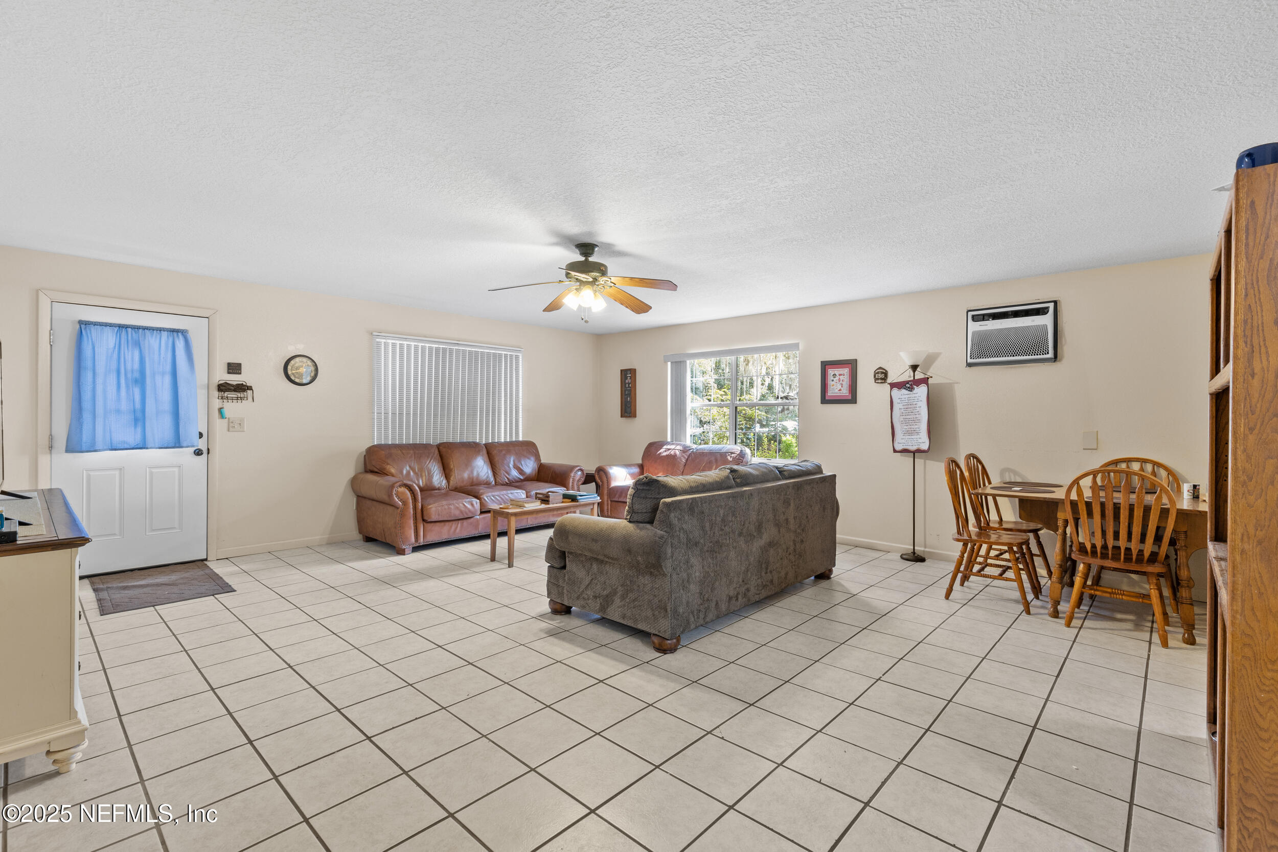 6441 Baker Road Keystone Heights, FL 32656 - Photo 28 of 66 a living room with furniture and a dining table
