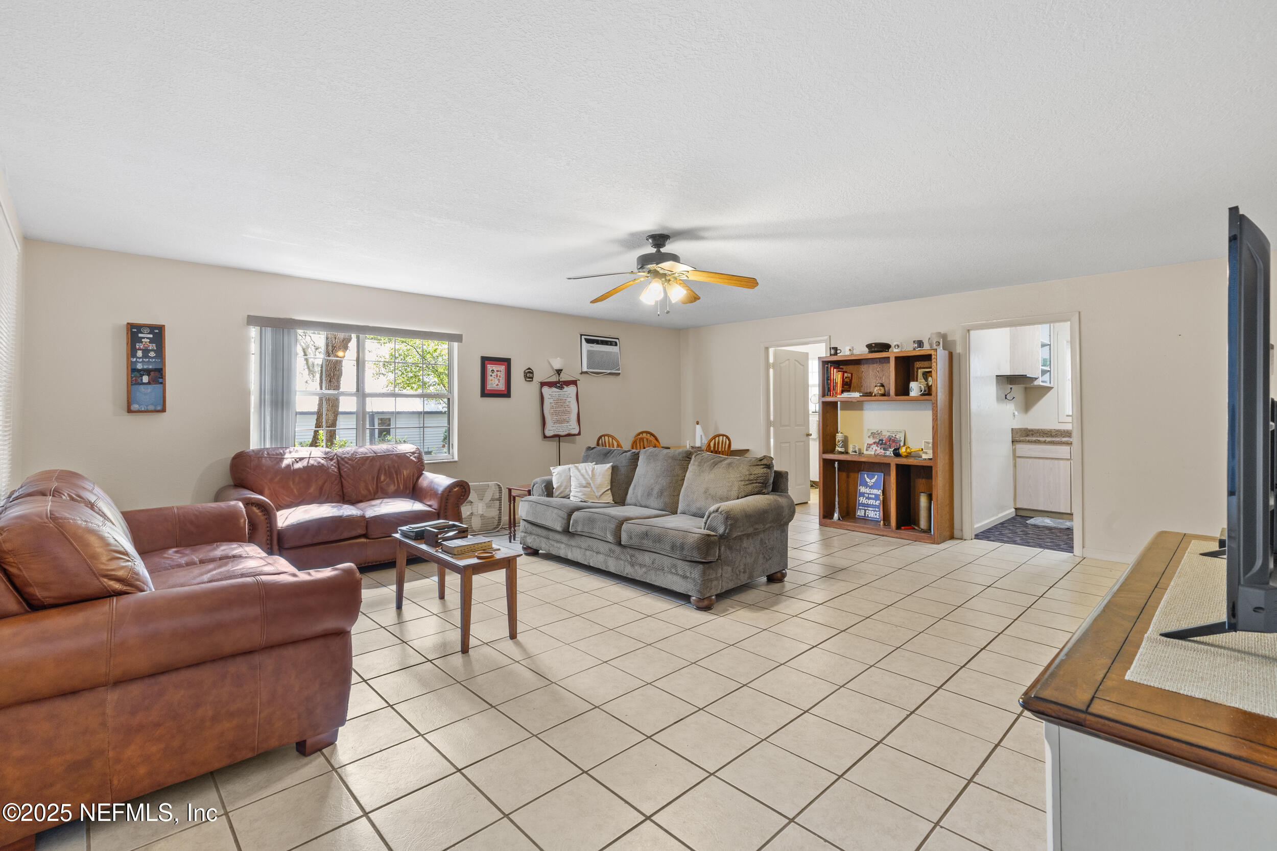 6441 Baker Road Keystone Heights, FL 32656 - Photo 29 of 66 a living room with furniture and a window