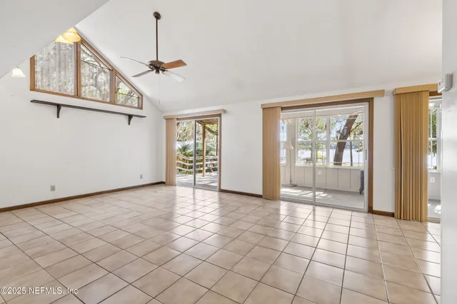 a view of entryway and hall with a floor to ceiling window