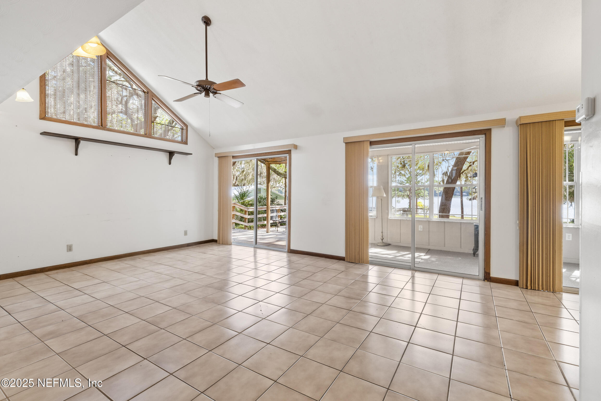 6441 Baker Road Keystone Heights, FL 32656 - Photo 3 of 66 a view of an entryway with wooden floor