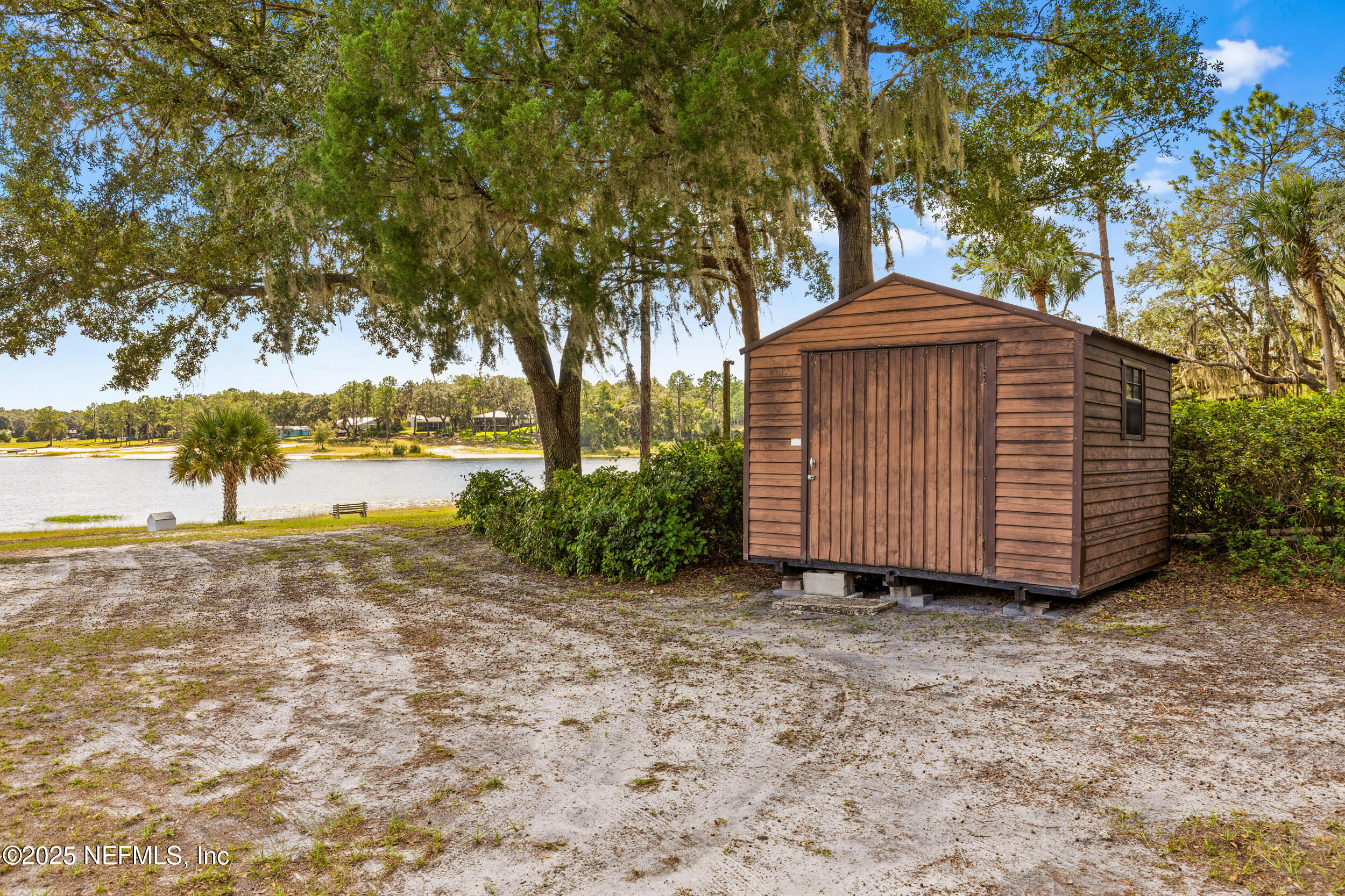 6441 Baker Road Keystone Heights, FL 32656 - Photo 33 of 66 a view of a house with a yard and sitting area