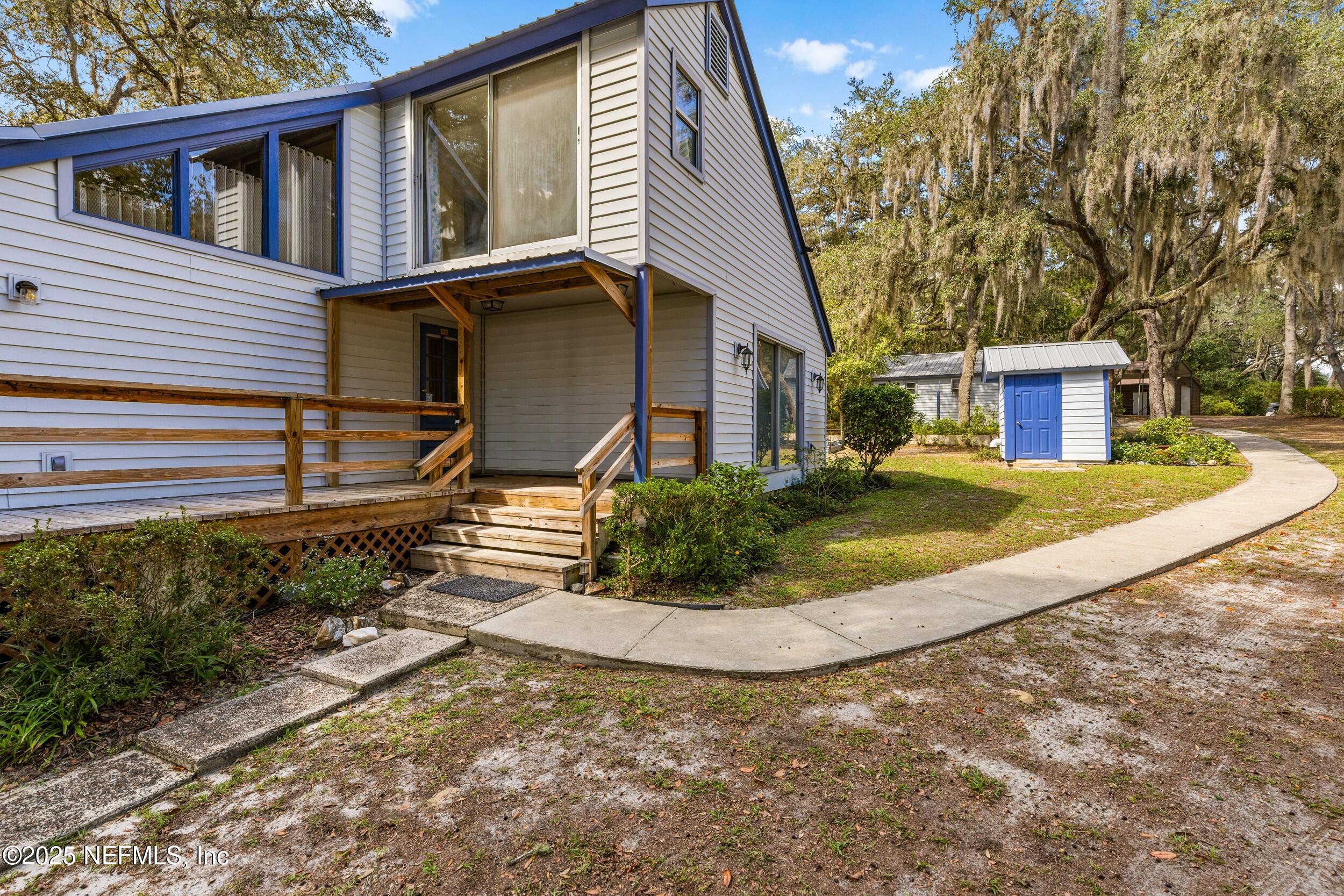6441 Baker Road Keystone Heights, FL 32656 - Photo 38 of 66 a view of a house with a yard