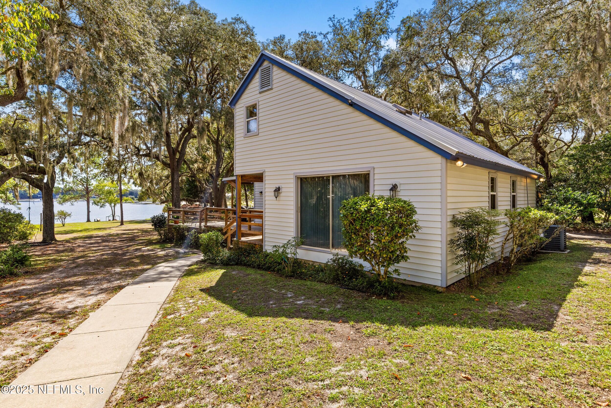6441 Baker Road Keystone Heights, FL 32656 - Photo 41 of 66 a view of a house with backyard and sitting area