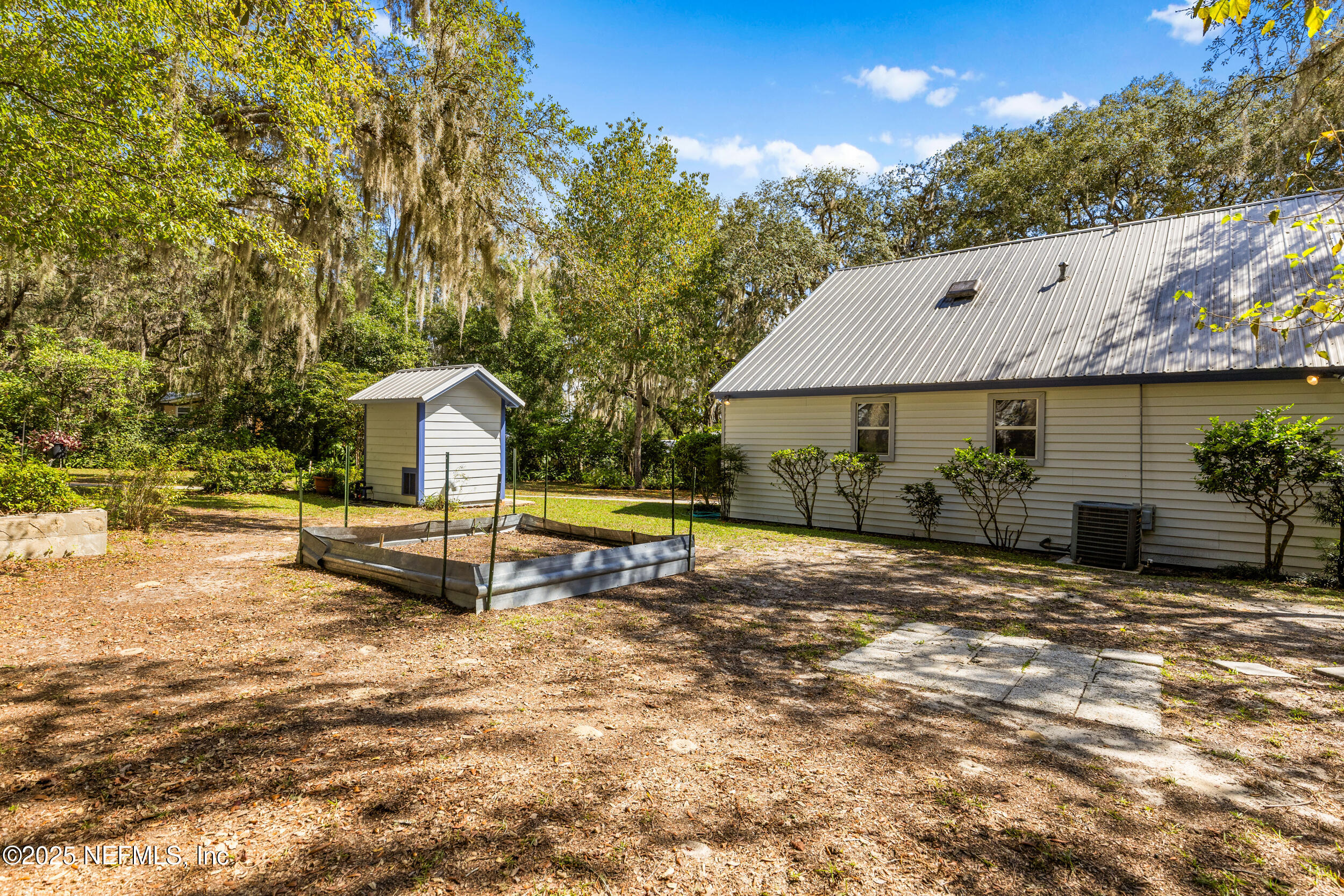 6441 Baker Road Keystone Heights, FL 32656 - Photo 45 of 66 a view of a house with backyard and sitting area