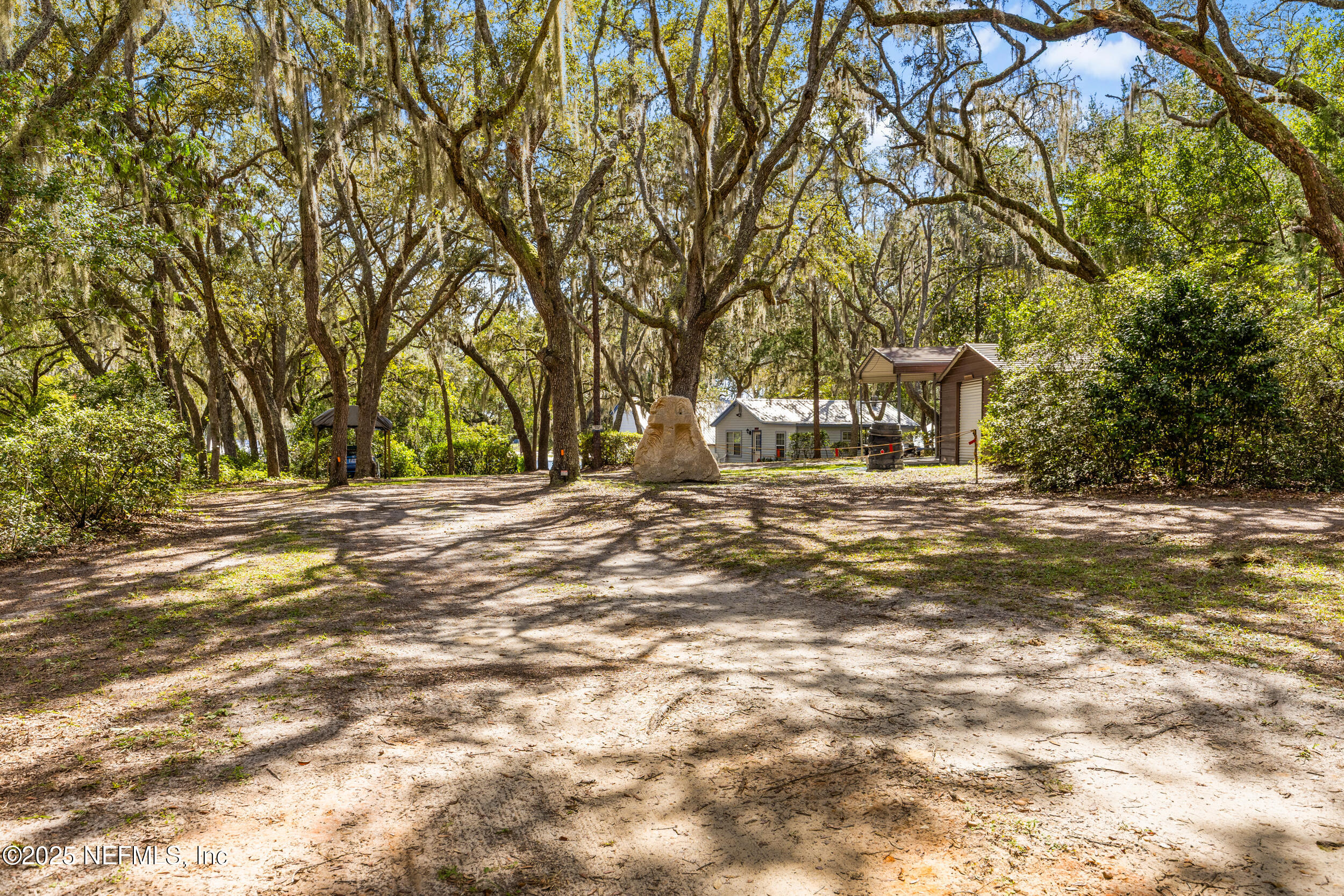 6441 Baker Road Keystone Heights, FL 32656 - Photo 52 of 66 a view of road with large trees