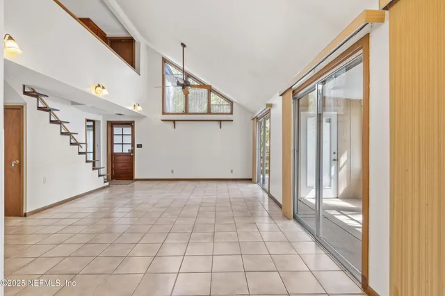 a en suite bathroom with a granite countertop sink and a mirror