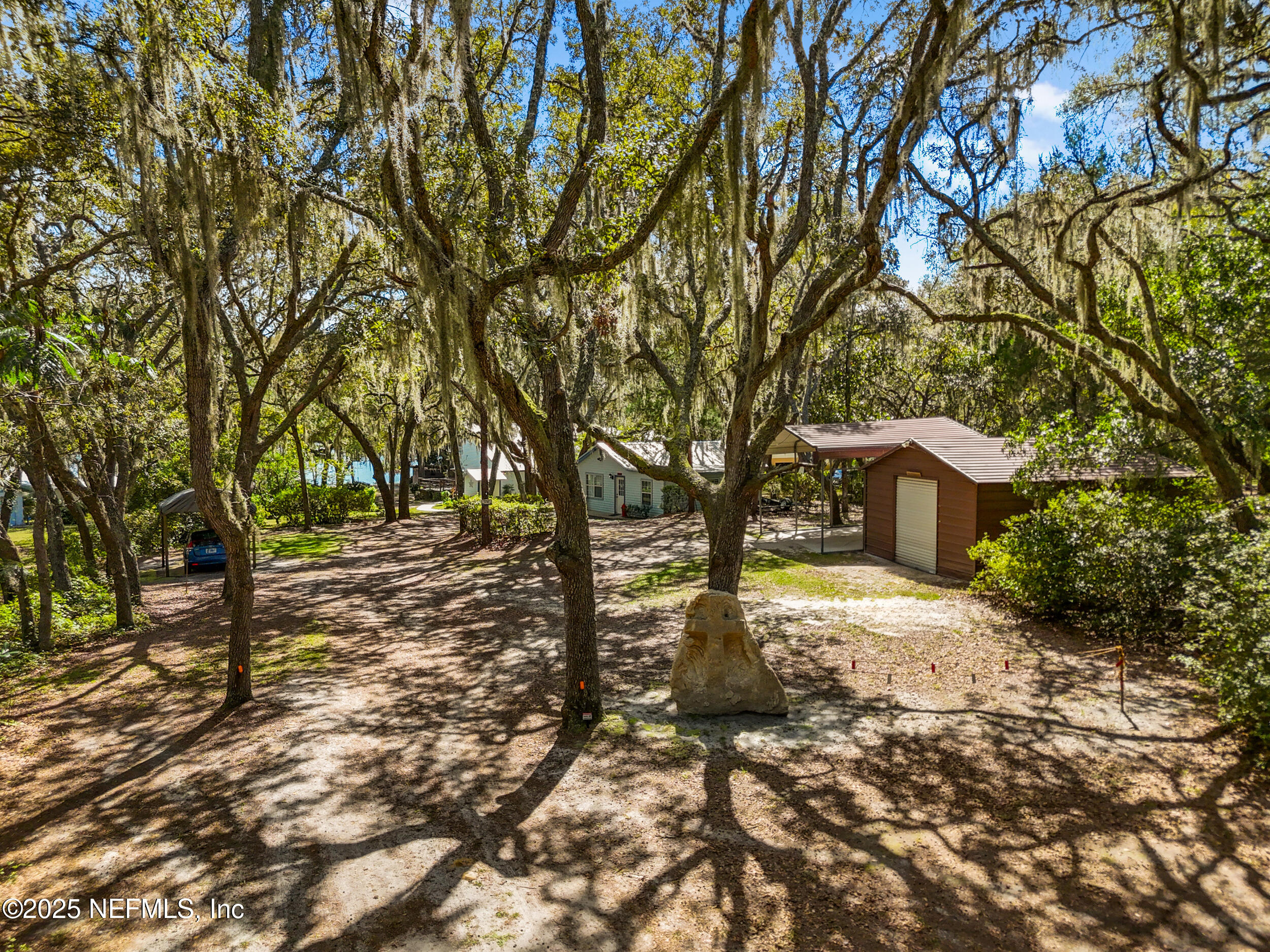 6441 Baker Road Keystone Heights, FL 32656 - Photo 66 of 66 a view of a yard with large trees