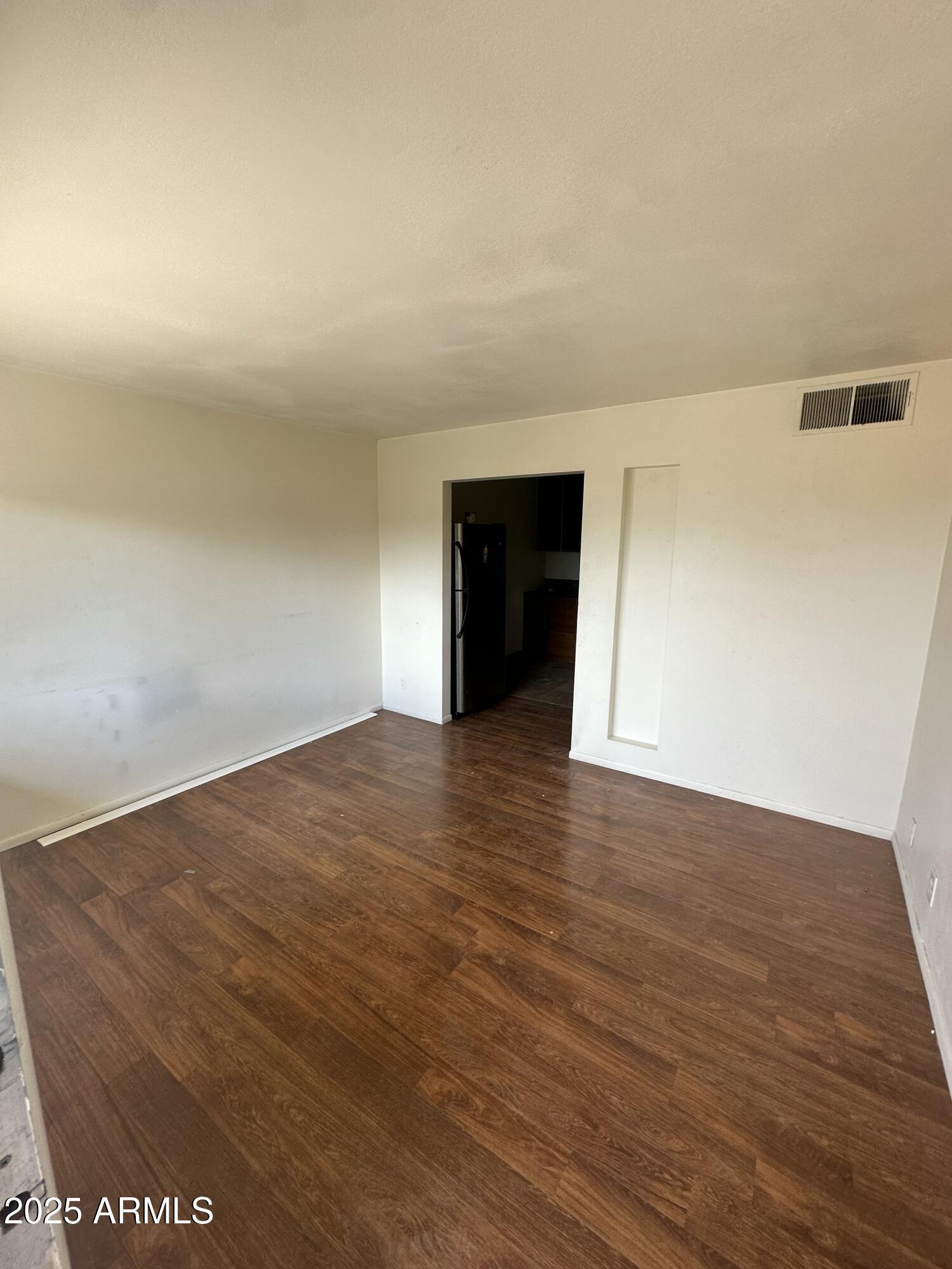 828 West 2nd Street, Unit C Tempe, AZ 85281 - Photo 3 of 15 a view of an empty room with wooden floor