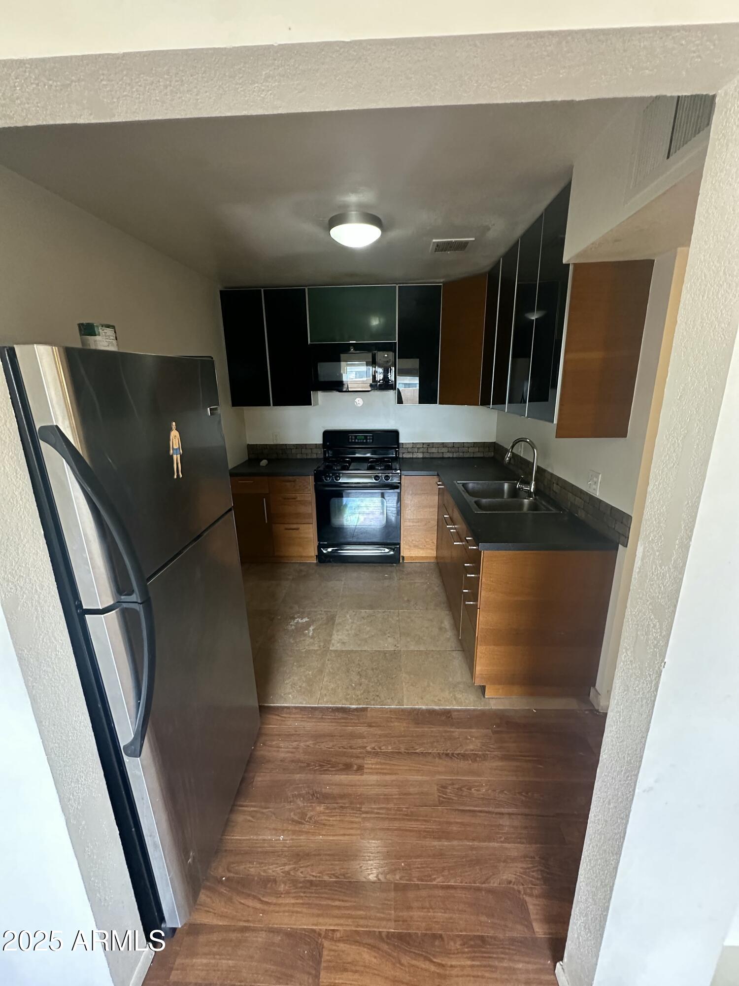 828 West 2nd Street, Unit C Tempe, AZ 85281 - Photo 5 of 15 a living room with furniture and a flat screen tv