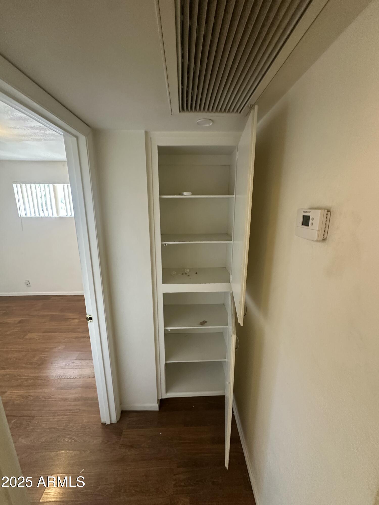 828 West 2nd Street, Unit C Tempe, AZ 85281 - Photo 9 of 15 a view of walk in closet with empty racks