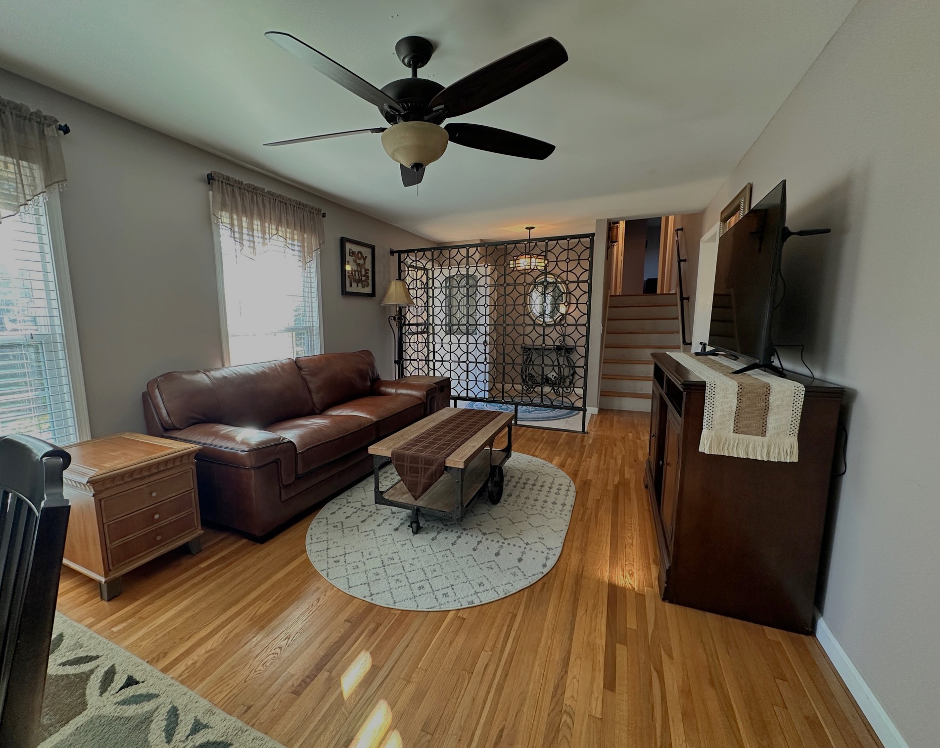303 Raintree Drive Hendersonville, TN 37075 - Photo 12 of 36 a living room with furniture and a flat screen tv