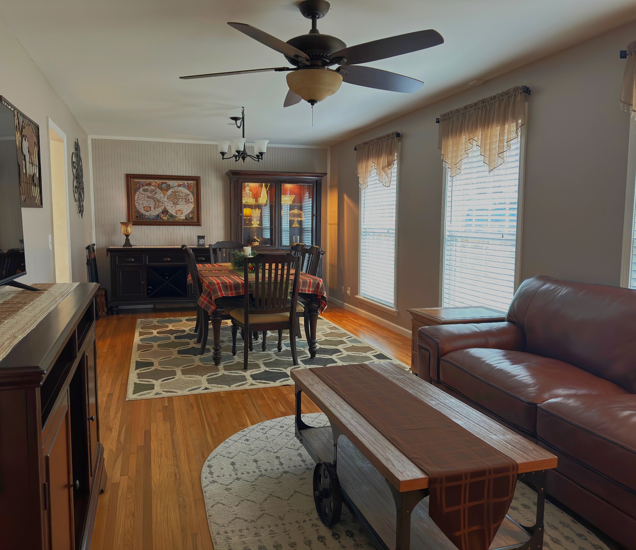 303 Raintree Drive Hendersonville, TN 37075 - Photo 18 of 36 a living room with furniture a chandelier and a window