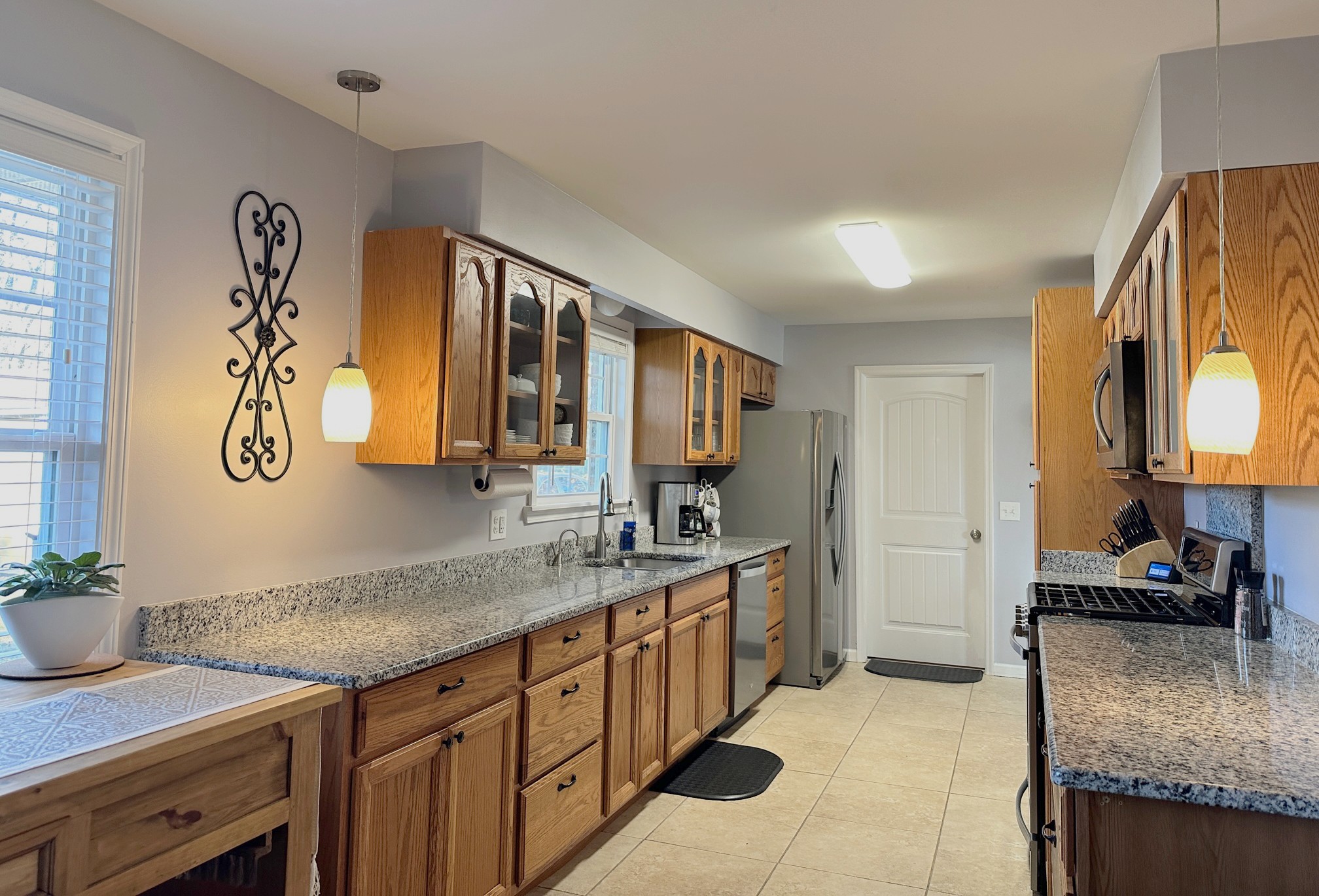 303 Raintree Drive Hendersonville, TN 37075 - Photo 19 of 36 a spacious bathroom with a granite countertop sink and a mirror