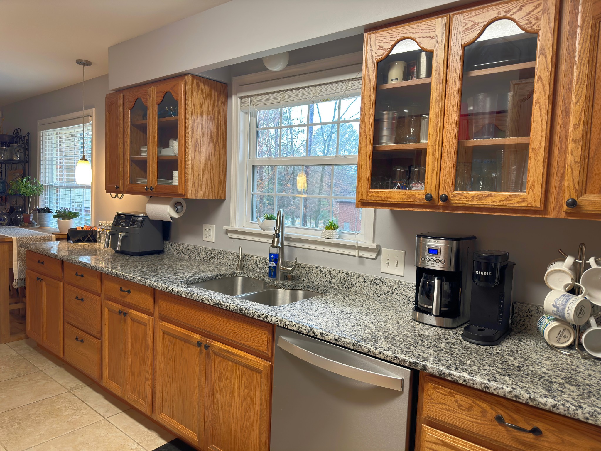 303 Raintree Drive Hendersonville, TN 37075 - Photo 21 of 36 a kitchen with granite countertop a sink and a window