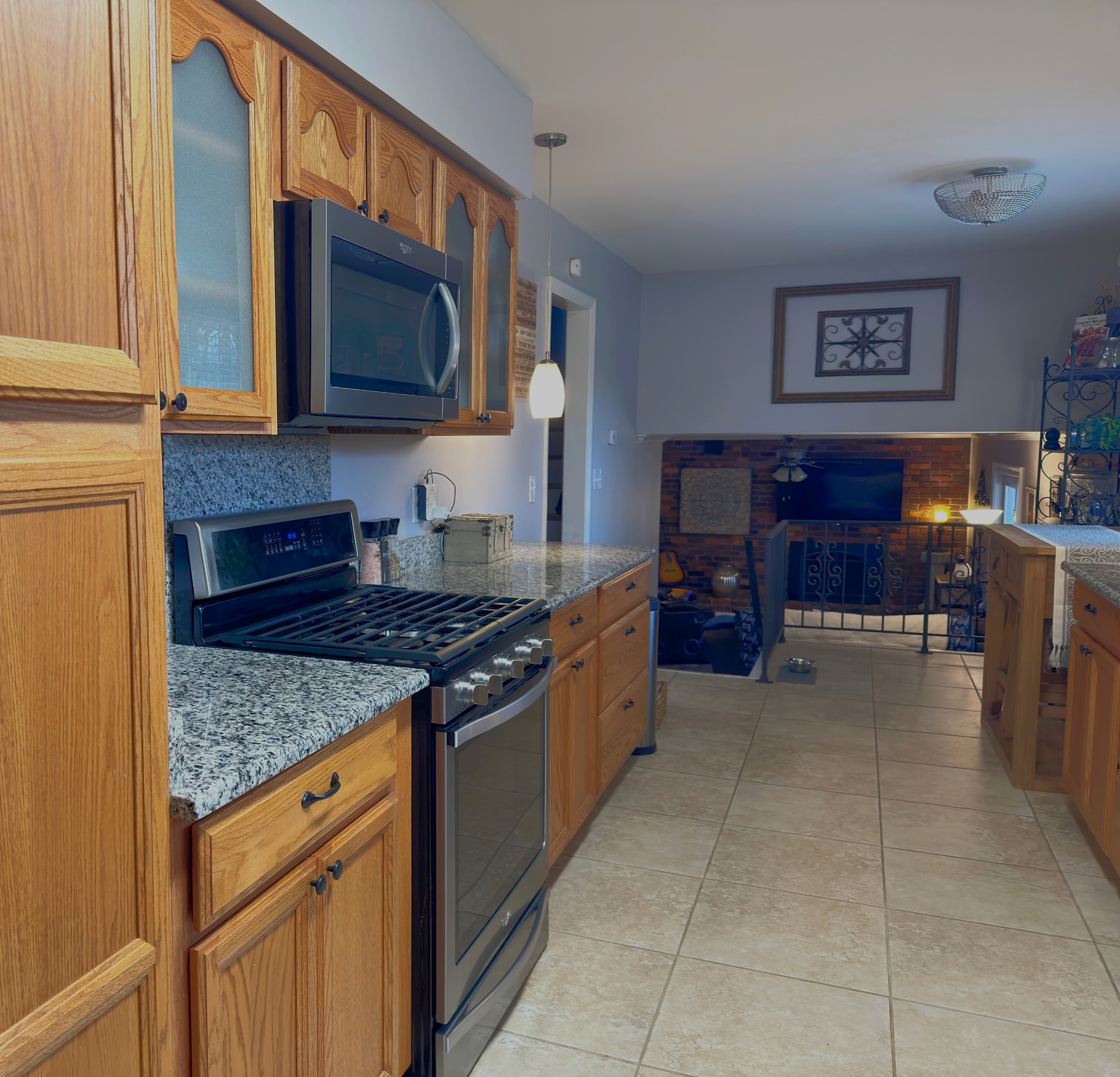 303 Raintree Drive Hendersonville, TN 37075 - Photo 22 of 36 a kitchen with stainless steel appliances granite countertop a stove and a microwave