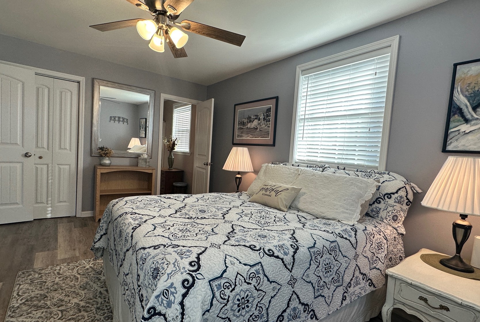303 Raintree Drive Hendersonville, TN 37075 - Photo 25 of 36 a bedroom with a bed and a chandelier