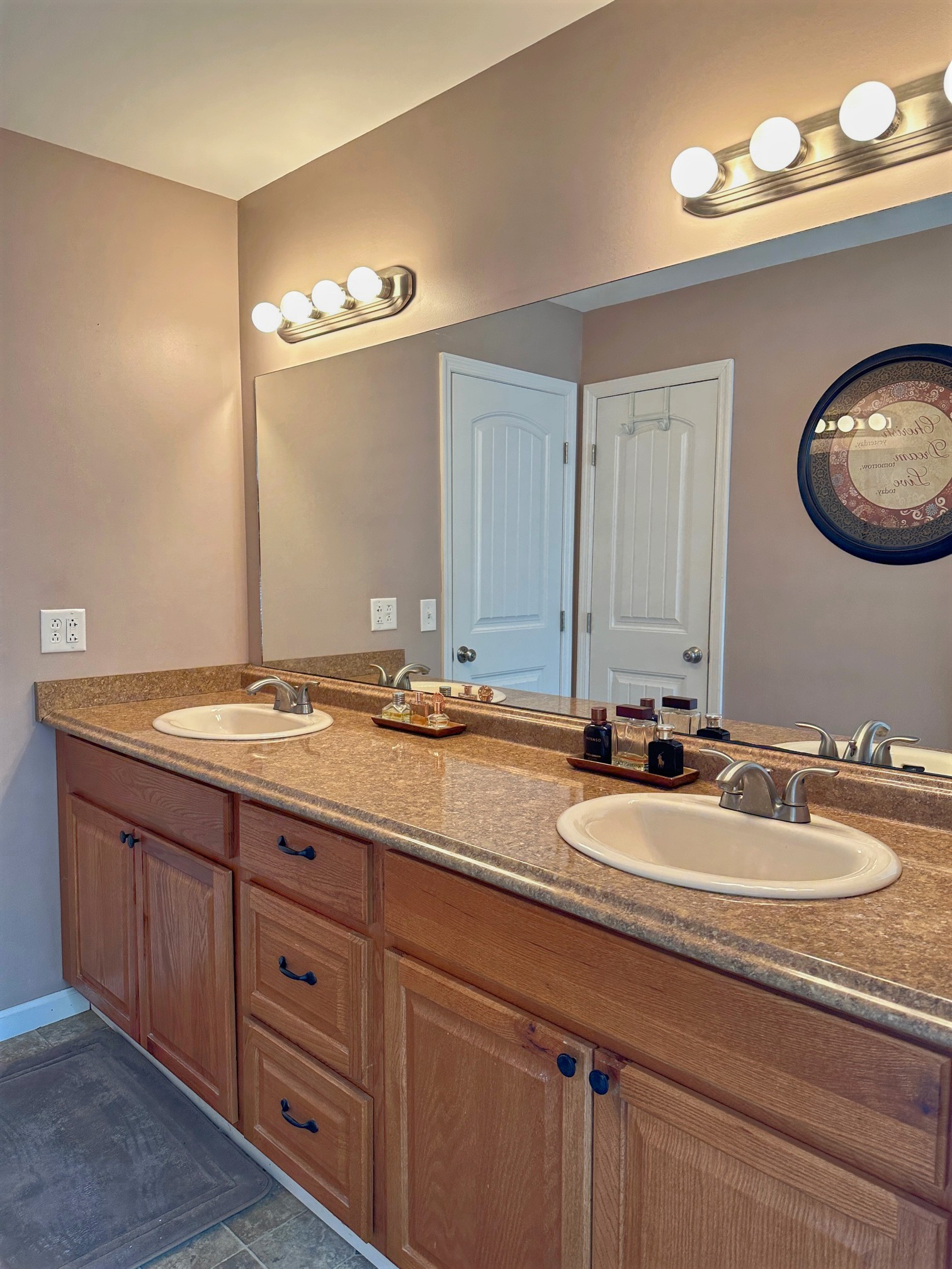 303 Raintree Drive Hendersonville, TN 37075 - Photo 32 of 36 a bathroom with double vanity sinks and a mirror