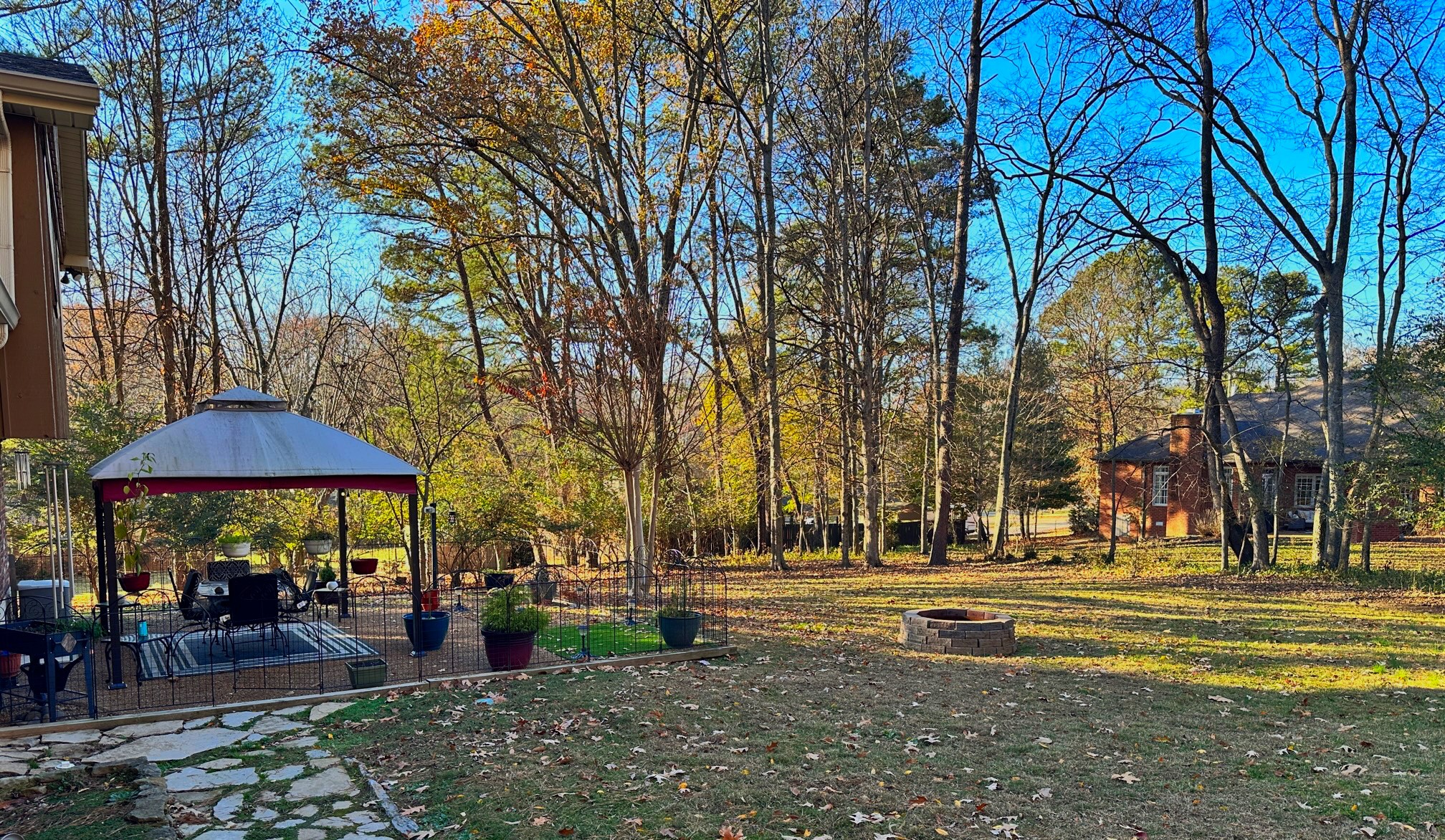 303 Raintree Drive Hendersonville, TN 37075 - Photo 10 of 36 a view of a swimming pool with a table and chairs under an umbrella