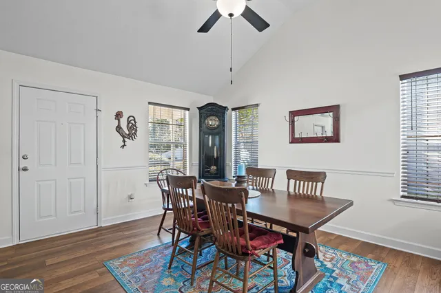 a view of a dining room with furniture window and wooden floor