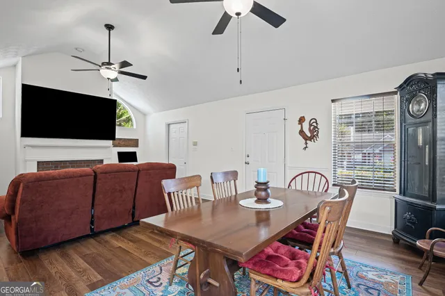 a view of a livingroom with furniture and a flat screen tv